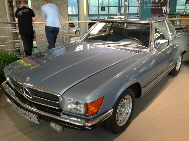 a mercedes 300 sl convertible is shown at the exhibit