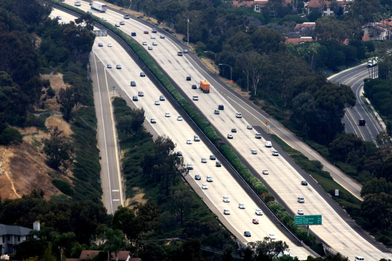 a highway going along a wooded area in the countryside