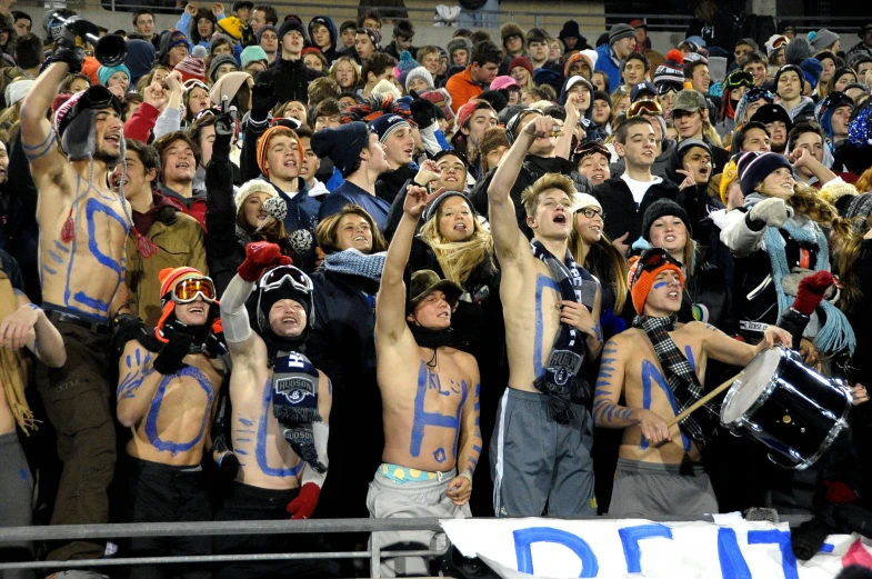 a group of men who are holding up signs