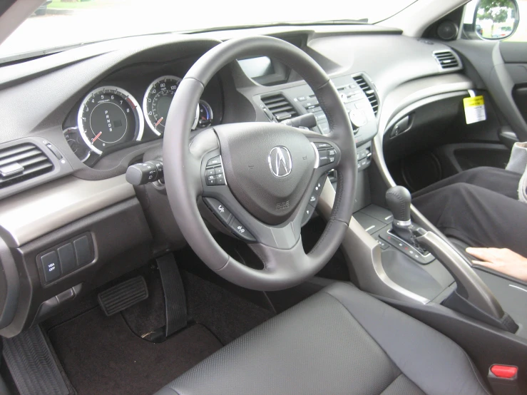 a woman is in the drivers seat and the dashboard of the vehicle