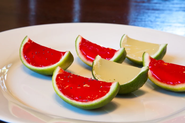 a white plate topped with slices of cut up fruit