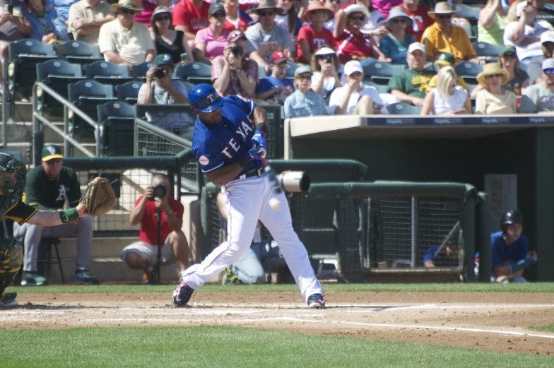 a baseball player swinging his bat on a field