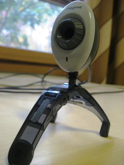 the small webcam is next to the computer monitor
