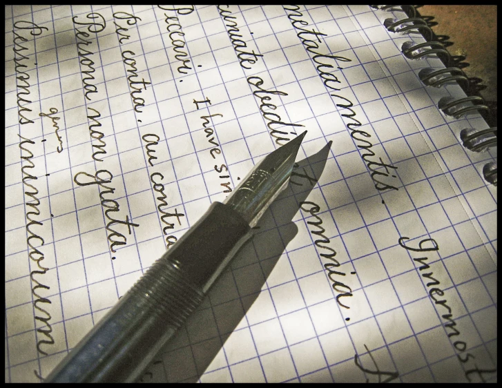 a pen sitting on top of a page of paper