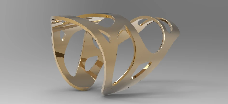 a gold ring with wavy lines on top