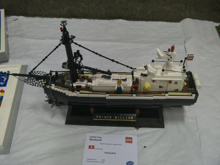 model boat being displayed with other items on table