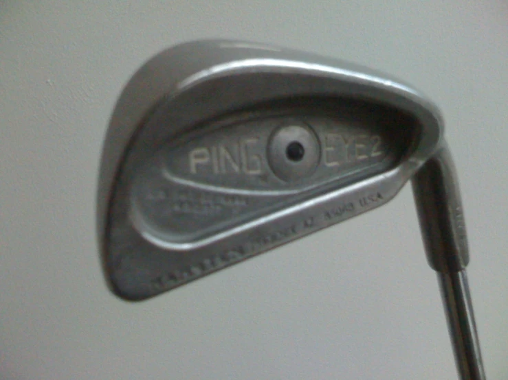 a close up of a golf club head