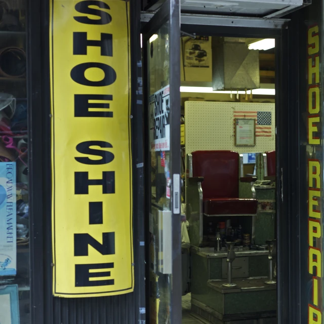 a store with a large yellow sign in front