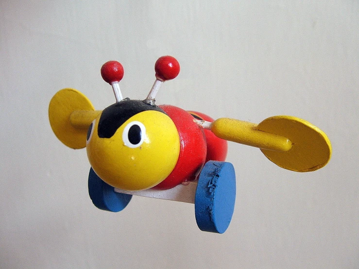 a plastic toy airplane floating in the air