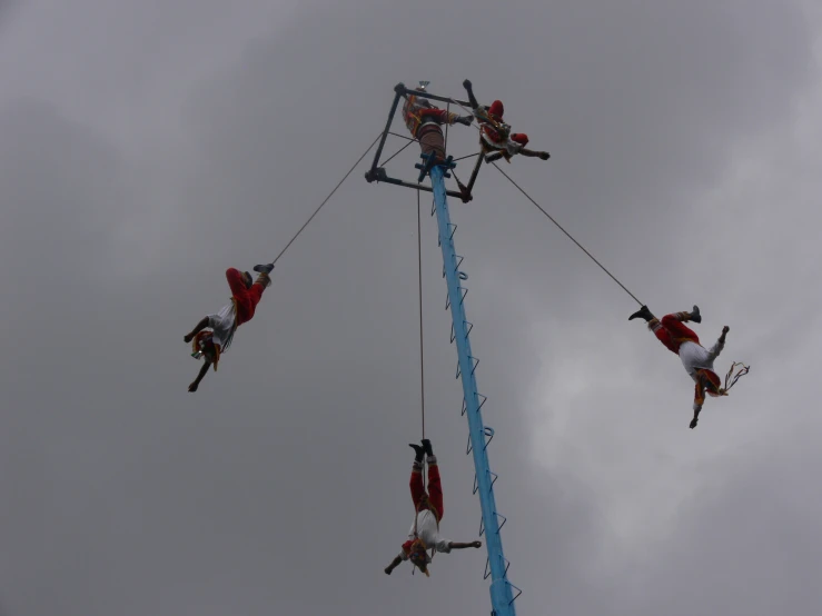 people doing a high jump on the ropes