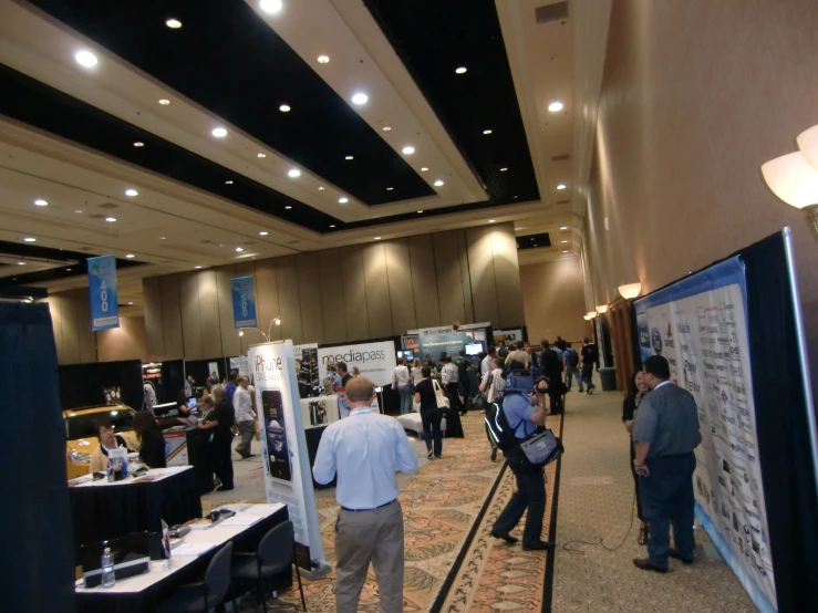 people are in line waiting to check out their job fair