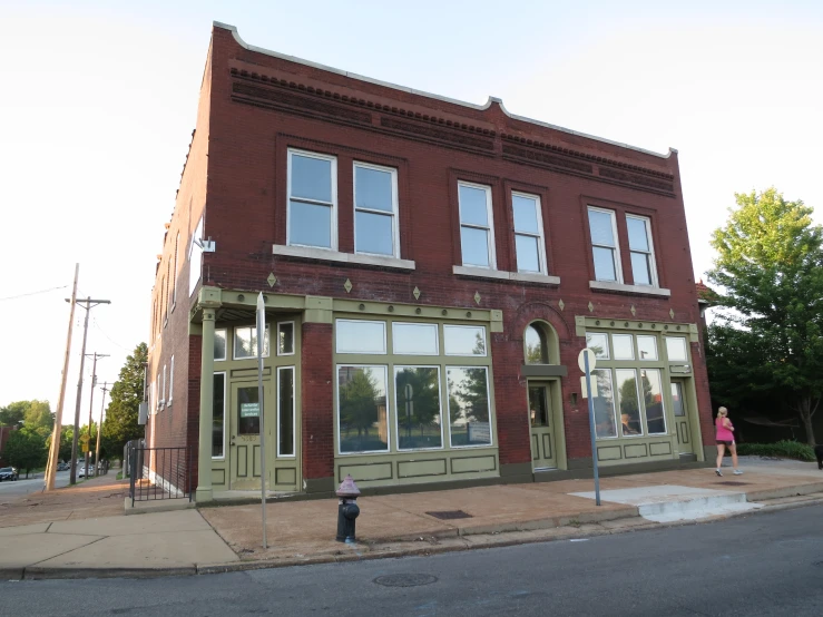 the two people stand outside of the building