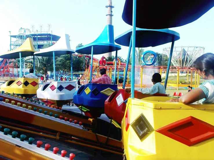 children at a carnival playing in the theme park