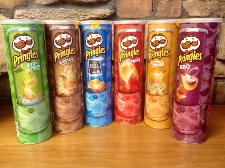 four cans of chips lined up on the table