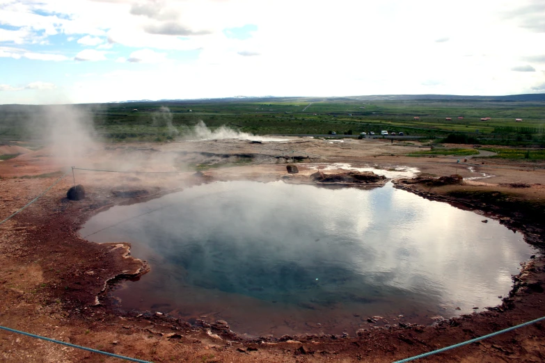 a large body of water that is sitting in the dirt