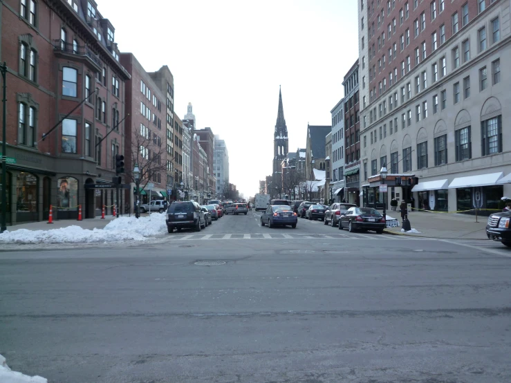 street with traffic in large city area on partly cloudy day