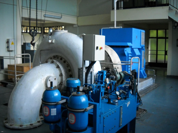 a blue and white machine sitting in a room