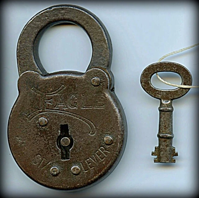 a small key and old lock to a house