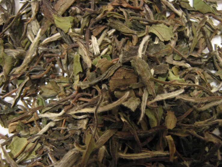 a pile of white and brown tea leaves