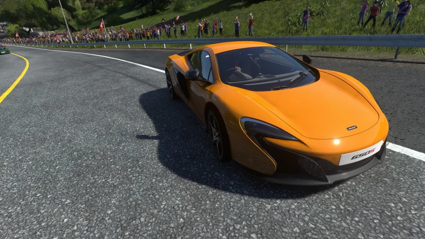 a yellow sports car driving on a track in a game