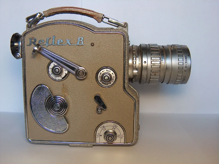 an old style camera with an object attached to it