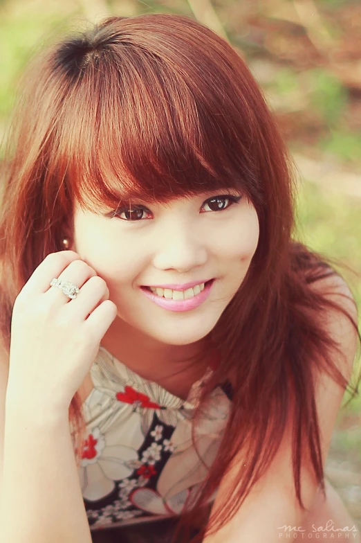 young lady with a smile and red hair