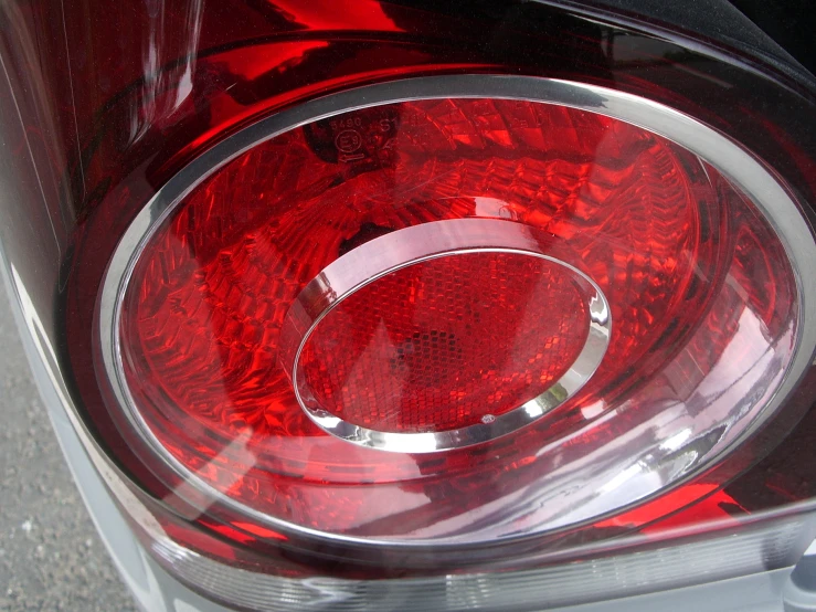 the tail light of a silver car