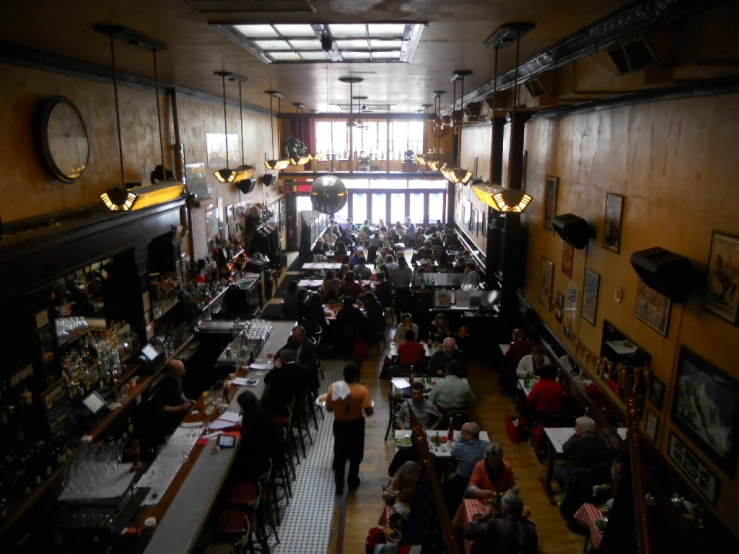 a restaurant with people dining and sitting