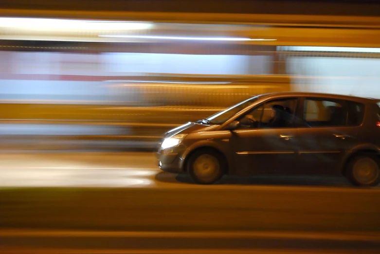 a car drives in motion on the street