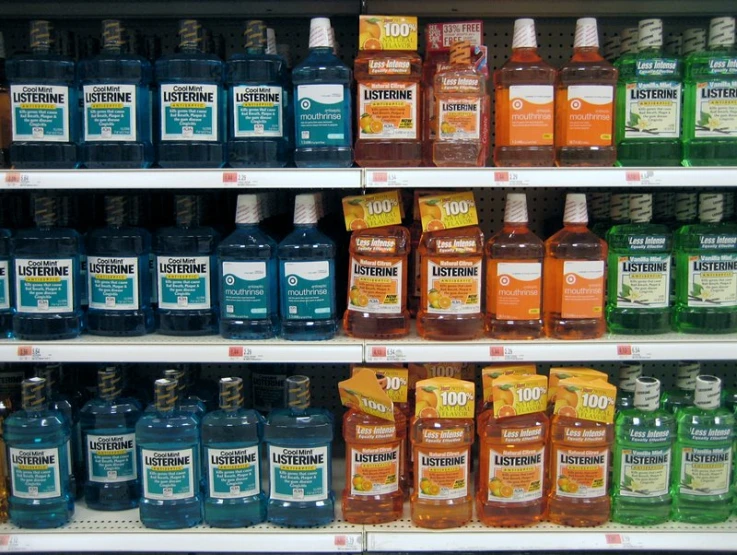 the shelves of a grocery store filled with various alcohol