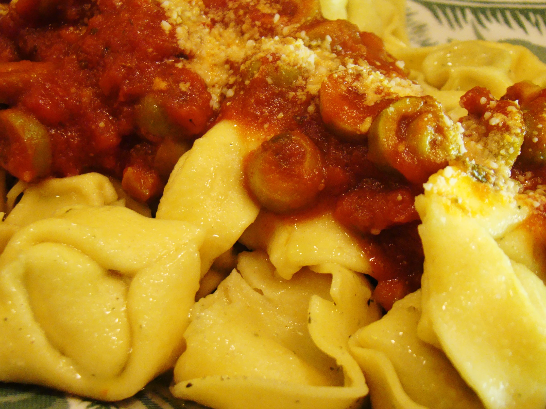 pasta with sauce and other vegetables on a plate