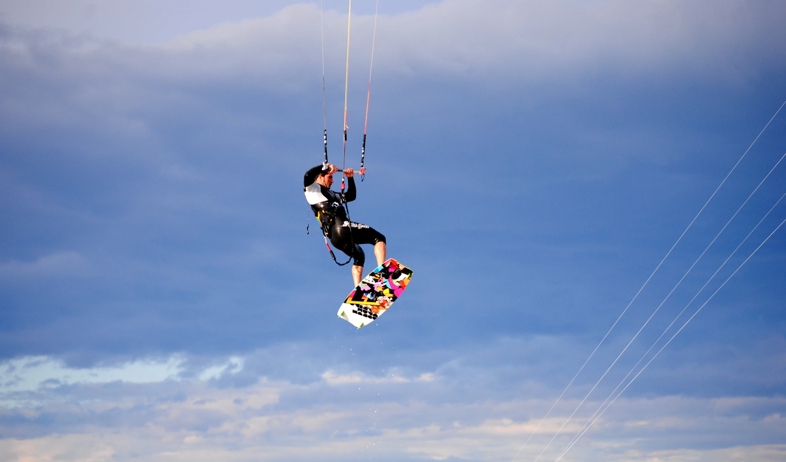 a person on a snowboard does tricks in the air