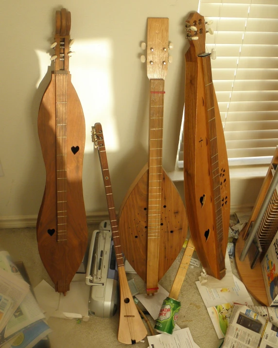 several wood music instruments sitting next to each other