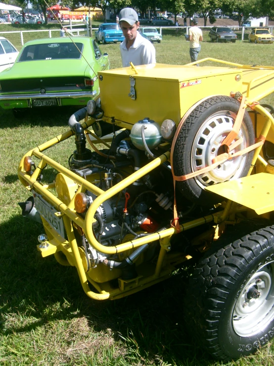 the yellow vehicle is parked in the grass