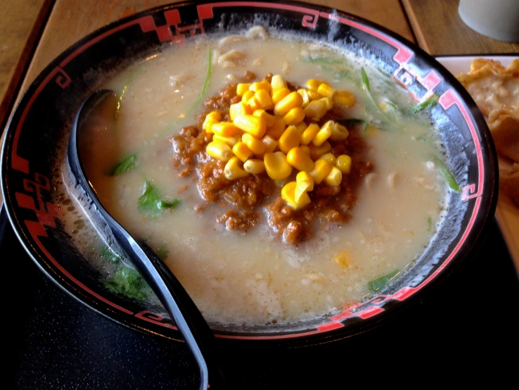 this soup has corn on top of it