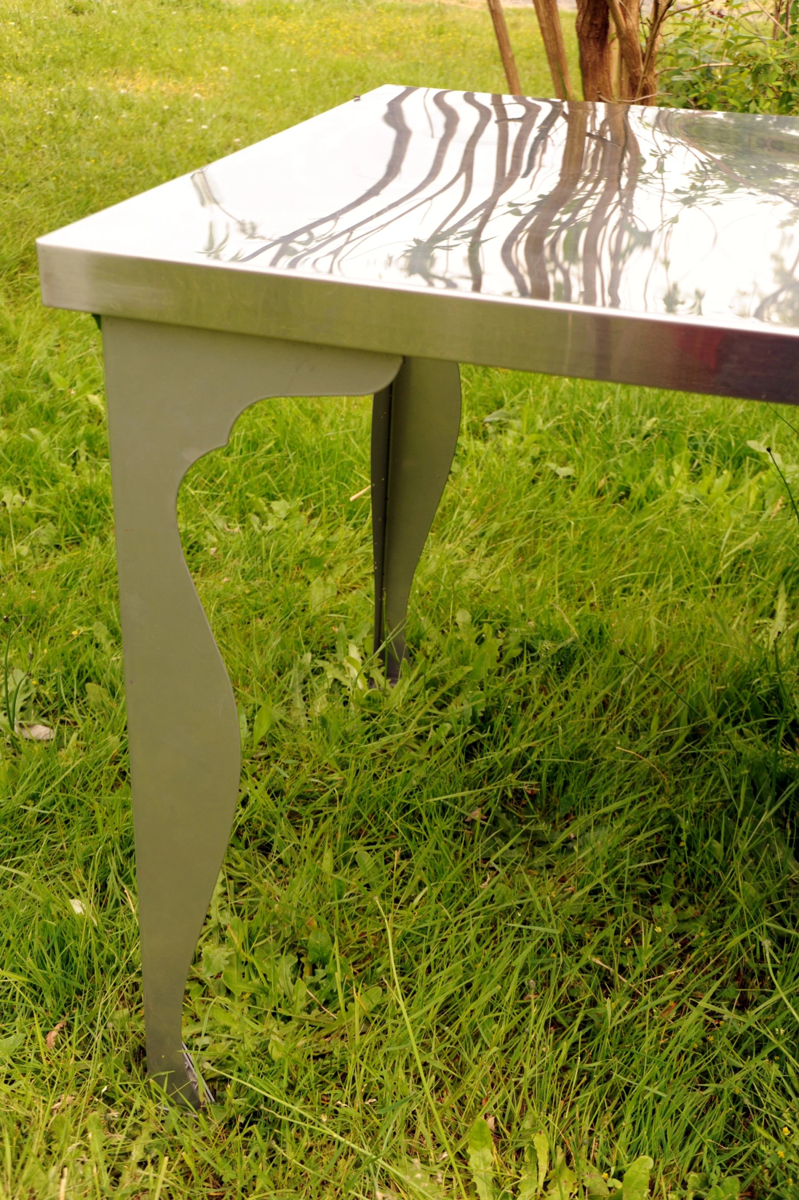 an unusual looking table on the grass