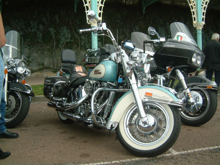 there are three different motorcycles that are parked