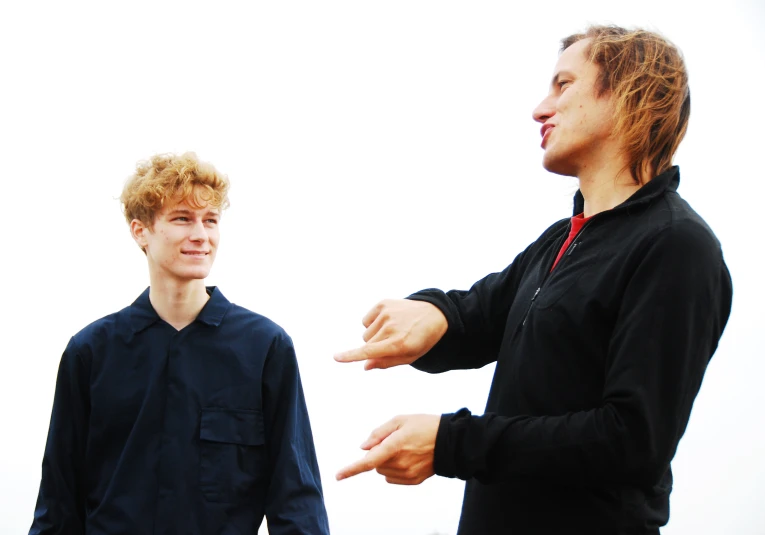 two guys having a discussion in the street