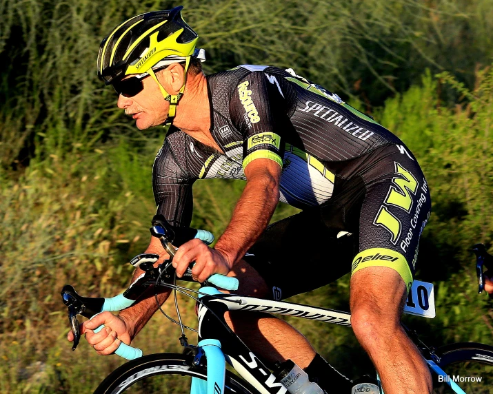 cyclist with reflective clothing riding on the road