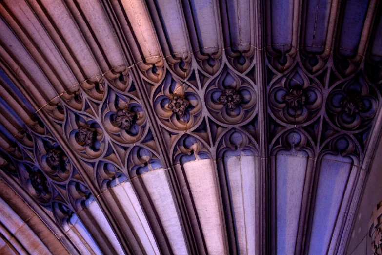 a ceiling decorated with ornate ironwork in a building