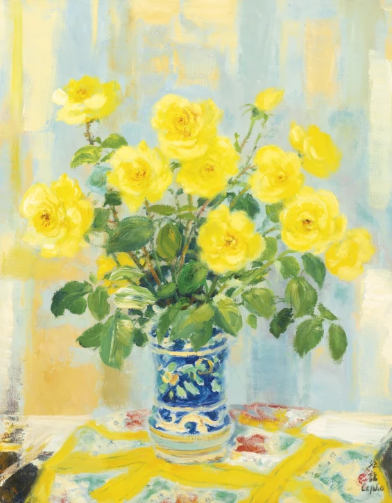 a vase filled with yellow flowers on a table