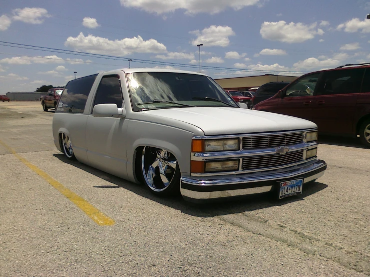 a white truck is parked in a parking lot