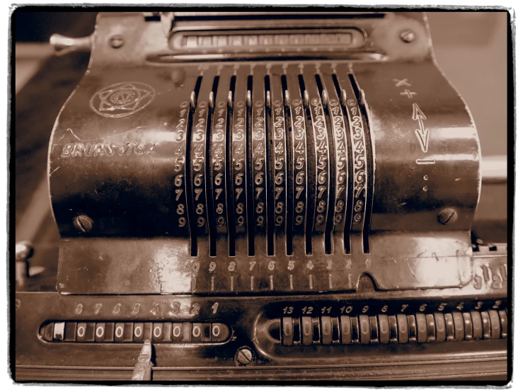 old fashioned typewriter on a table in sepia tone