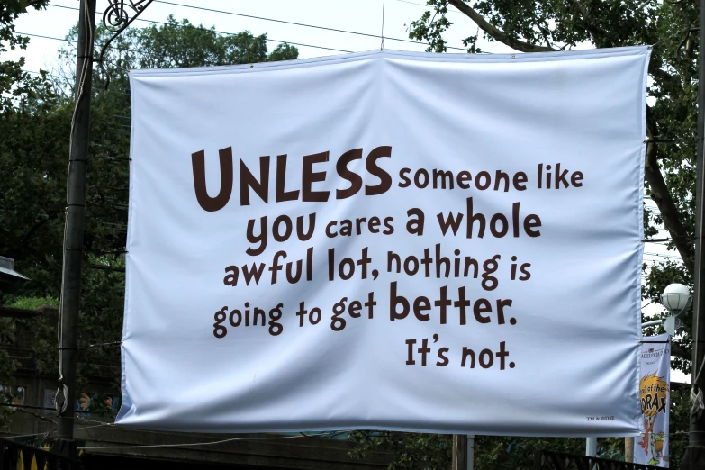 a protest poster is displayed on a street