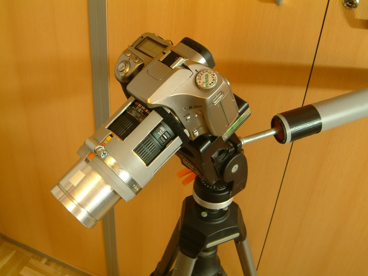 a tripod that has some pictures attached to it