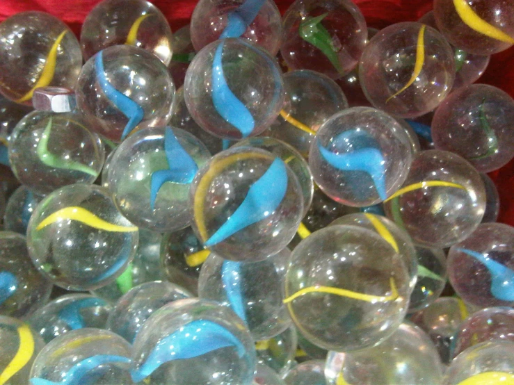 several different clear colored bubble ball toys