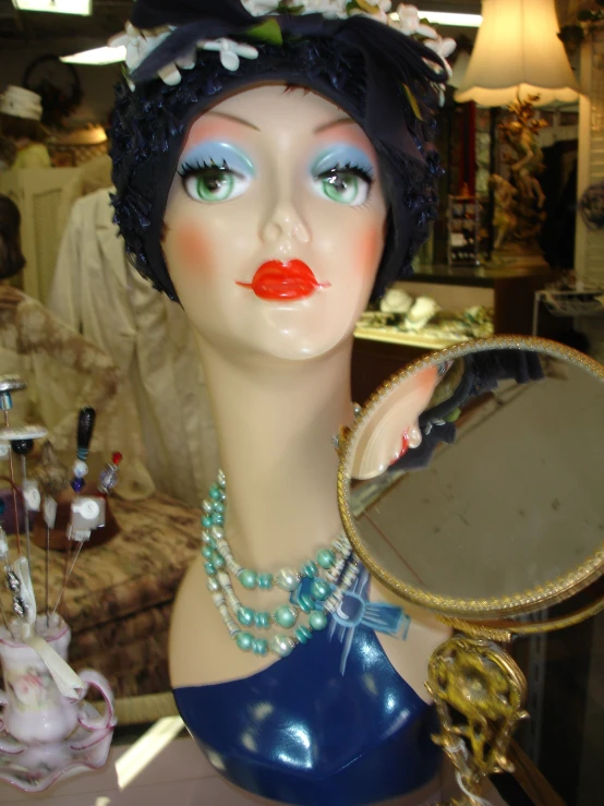 a doll that has been displayed wearing jewelry