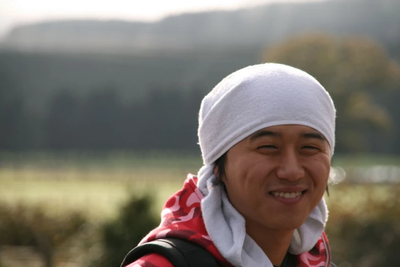 a woman with a white hat on top of her head