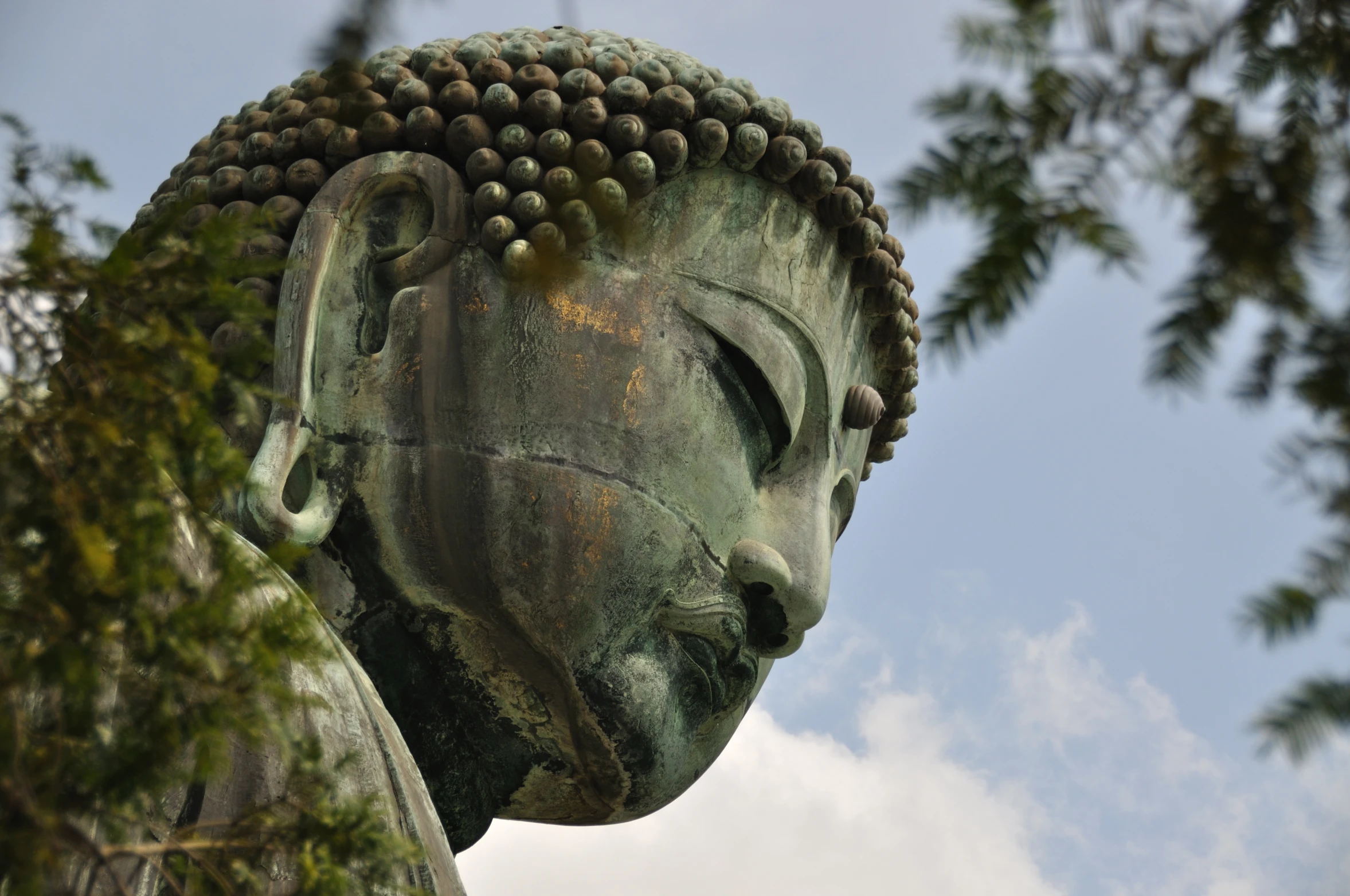 a large buddha statue with its eyes open