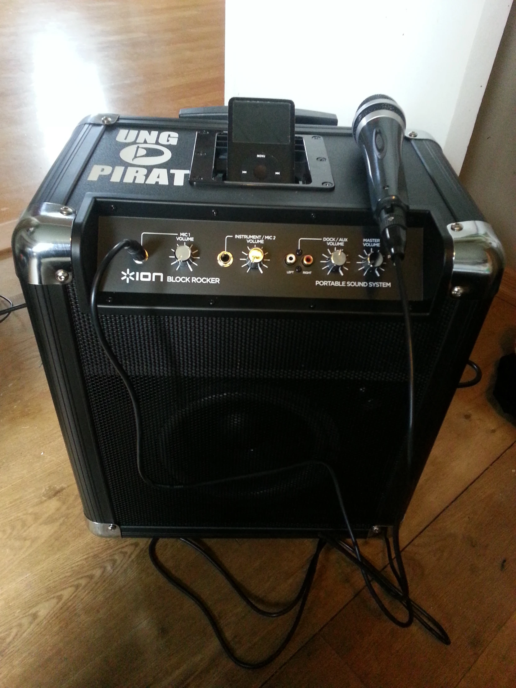 a guitar amp sitting on top of a hard wood floor